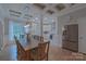 Spacious dining room featuring a coffered ceiling and an open layout to the kitchen at 10604 Russet Pl, Charlotte, NC 28227