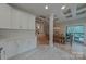 Bright kitchen with white cabinets, stainless steel appliances, and an open layout at 10604 Russet Pl, Charlotte, NC 28227