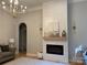 Cozy living room featuring a shiplap fireplace, hardwood floors, and stylish decor at 10604 Russet Pl, Charlotte, NC 28227