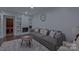 Modern living room featuring a fireplace, built-in shelving, and cozy seating area at 10604 Russet Pl, Charlotte, NC 28227