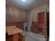 Relaxing sauna room features a wood-fired stove, wood-paneled walls, and a classic design at 10604 Russet Pl, Charlotte, NC 28227