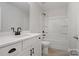 Clean bathroom featuring white vanity, quartz countertop, and tub-shower combo at 8605 Carly Ln, Mint Hill, NC 28227