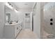 Elegant bathroom with double vanity, marble countertop, and glass-enclosed shower at 8605 Carly Ln, Mint Hill, NC 28227
