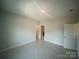 Spacious room features neutral walls and ample natural light from the window at 8605 Carly Ln, Mint Hill, NC 28227