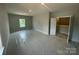 A spacious bedroom has natural light from the window and an open closet at 8605 Carly Ln, Mint Hill, NC 28227