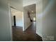 Inviting foyer featuring hardwood floors, elegant wainscoting, and staircase at 8605 Carly Ln, Mint Hill, NC 28227