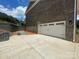 Spacious two-car garage and a freshly paved driveway in front of home at 8605 Carly Ln, Mint Hill, NC 28227