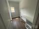 Bright laundry room with shelving, a window, and a folding table at 8605 Carly Ln, Mint Hill, NC 28227
