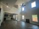 The living room has high ceilings, a fireplace, and a view of the kitchen at 8605 Carly Ln, Mint Hill, NC 28227