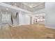 Spacious open-concept design with hardwood floors, modern finishes, and access to the kitchen at 8605 Carly Ln, Mint Hill, NC 28227