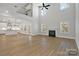 Spacious living room featuring high ceilings, a fireplace, and hardwood floors at 8605 Carly Ln, Mint Hill, NC 28227