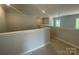The loft overlooks the living room, and has windows for natural light at 8605 Carly Ln, Mint Hill, NC 28227