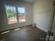 Bright spare room with hardwood floors and a large window view at 8605 Carly Ln, Mint Hill, NC 28227