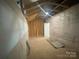 Spacious unfinished basement provides an opportunity for customization and expansion at 8605 Carly Ln, Mint Hill, NC 28227