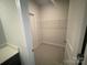 Convenient walk-in closet boasts ample shelving for optimal organization at 8605 Carly Ln, Mint Hill, NC 28227