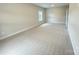 Spacious bedroom features neutral walls, carpet, and a window that provides plenty of natural light at 9411 Stonebridge Way # 49, Mint Hill, NC 28227