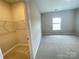 The walk-in closet offers ample storage space with built-in wire shelving and a view of the bedroom at 9411 Stonebridge Way # 49, Mint Hill, NC 28227