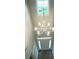 The chandelier hangs above the foyer and front door with sidelights at 9411 Stonebridge Way # 49, Mint Hill, NC 28227