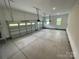 Clean, expansive three-car garage with ample space for vehicles and storage at 9411 Stonebridge Way # 49, Mint Hill, NC 28227
