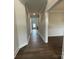 Elegant hallway featuring wood floors and stylish trim work at 9411 Stonebridge Way # 49, Mint Hill, NC 28227
