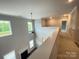 Bright, neutral hallway boasts natural light, high ceilings, and seamless transition to the rest of the house at 9411 Stonebridge Way # 49, Mint Hill, NC 28227