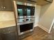 Stainless steel oven and microwave with a stylish backsplash and countertop at 9411 Stonebridge Way # 49, Mint Hill, NC 28227