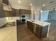 Modern kitchen with a center island, stainless steel appliances, and ample counter space at 9411 Stonebridge Way # 49, Mint Hill, NC 28227