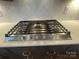Frigidaire gas cooktop installed on a white marbled countertop with a white backsplash at 9411 Stonebridge Way # 49, Mint Hill, NC 28227