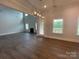 Spacious living room with a fireplace, plenty of natural light, and a door to the outside at 9411 Stonebridge Way # 49, Mint Hill, NC 28227