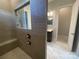 This tiled shower has a built-in bench, window and modern fixtures at 9411 Stonebridge Way # 49, Mint Hill, NC 28227