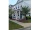 Two-story townhome with gray siding, front porch, and landscaping at 13969 Clayborn St, Midland, NC 28107