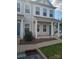 Two-story townhome with gray siding, front porch, and landscaping at 13969 Clayborn St, Midland, NC 28107