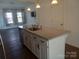 Kitchen island with granite countertop and white shaker cabinets at 13969 Clayborn St, Midland, NC 28107