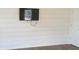 Living room with hardwood floors and white shiplap accent wall at 13969 Clayborn St, Midland, NC 28107