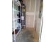 Unfinished utility room with shelving and water heater at 13969 Clayborn St, Midland, NC 28107