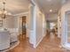 Hardwood floor hallway connecting dining and living areas at 11612 Kingsley View Dr, Charlotte, NC 28277