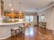 Open kitchen boasts a large island, stainless steel appliances, and hardwood floors at 11612 Kingsley View Dr, Charlotte, NC 28277