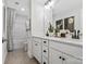 Bathroom with double sinks, white cabinets, and a large mirror creates a clean and bright space at 136 Ella Claire Dr, York, SC 29745