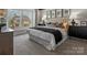 A luxurious bedroom featuring large windows, plush bedding, and stylish decor at 136 Ella Claire Dr, York, SC 29745