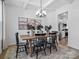 This dining room features coffered ceilings, modern chandelier, and neutral paint colors at 136 Ella Claire Dr, York, SC 29745