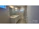 Bathroom featuring double sinks, updated fixtures, glass enclosed shower, and crisp, neutral decor at 143 Ella Claire Dr, York, SC 29745