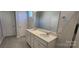Bathroom featuring a double sink vanity with elegant fixtures, tile flooring, and bright lighting at 143 Ella Claire Dr, York, SC 29745