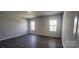 Spacious primary bedroom with wood flooring and large windows providing natural light at 151 Ella Claire Dr, York, SC 29745