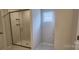 Modern tiled bathroom with a glass shower door and a view of a private water closet at 169 Ella Claire Dr, York, SC 29745