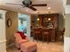 Stylish bar area featuring a built-in wooden bar, bar stools, and decorative shelving at 24756 Strand Dr, Albemarle, NC 28001