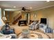 Basement with a staircase, game table, TV and lounge area, and neutral carpeting at 24756 Strand Dr, Albemarle, NC 28001