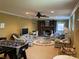 Finished basement featuring a fireplace, entertainment area, and game table, perfect for gatherings at 24756 Strand Dr, Albemarle, NC 28001