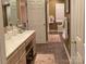 Well-lit bathroom featuring a long vanity with drawers and seating, as well as a private toilet area at 24756 Strand Dr, Albemarle, NC 28001