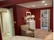 Inviting bedroom with an ensuite bathroom, a comfortable chair and a matching white dresser at 24756 Strand Dr, Albemarle, NC 28001