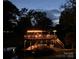 A charming wooden dock is lit with string lights and has space for a boat at 24756 Strand Dr, Albemarle, NC 28001